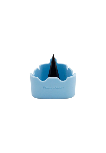 A blue container with a black object inside, sitting on a white background.