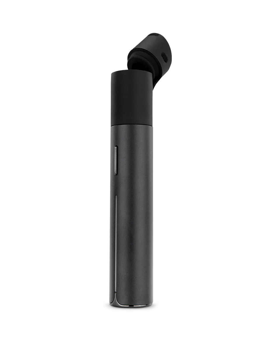 A black cylindrical object with a black cap is shown against a black background.