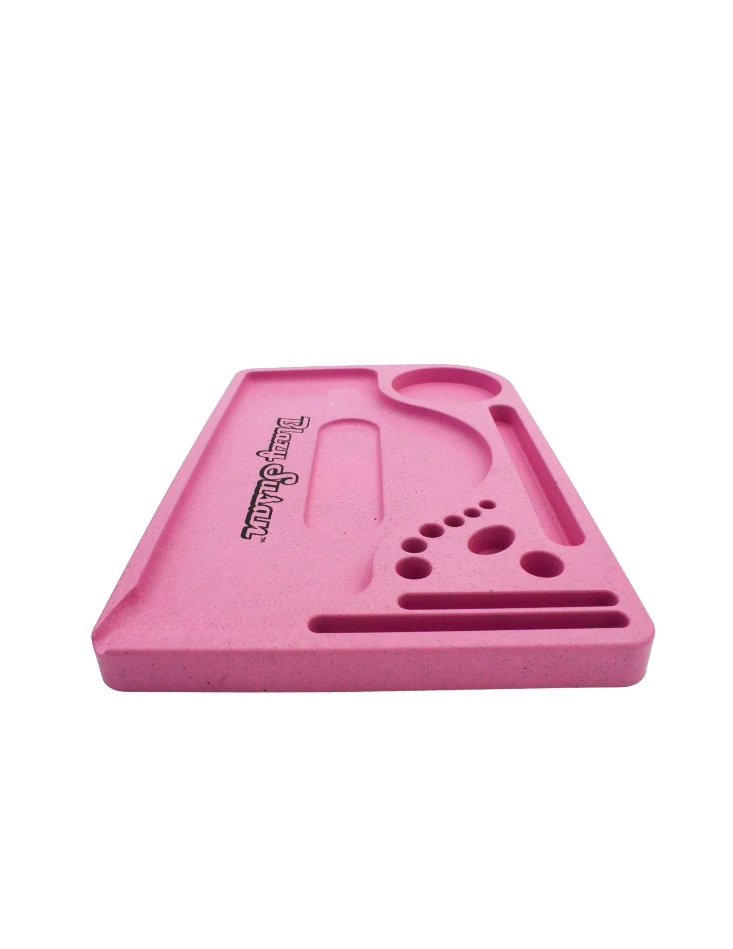 A pink, rectangular tray with various holes and a curved edge, likely used for organizing and storing small items.