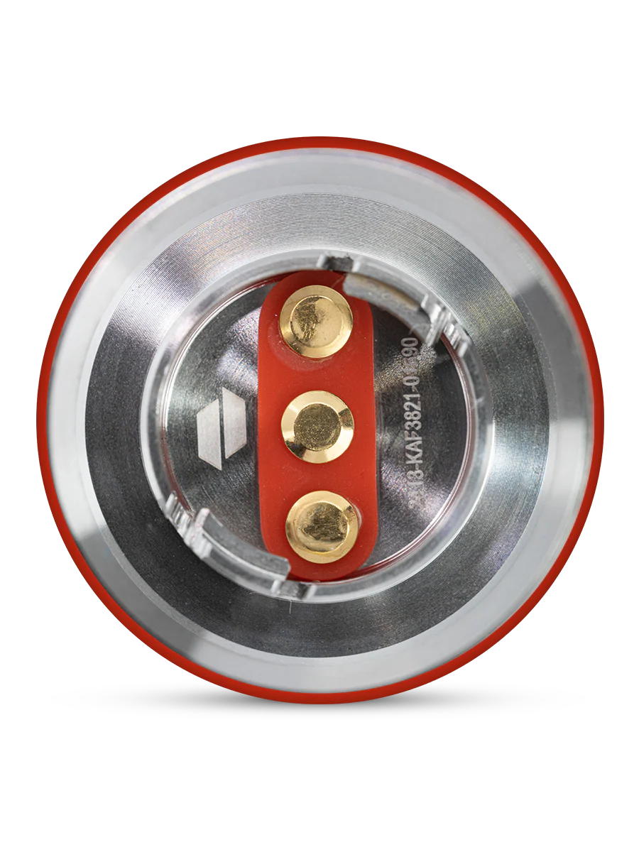 a close-up view of a metallic object with a red and silver color scheme, featuring three circular components.