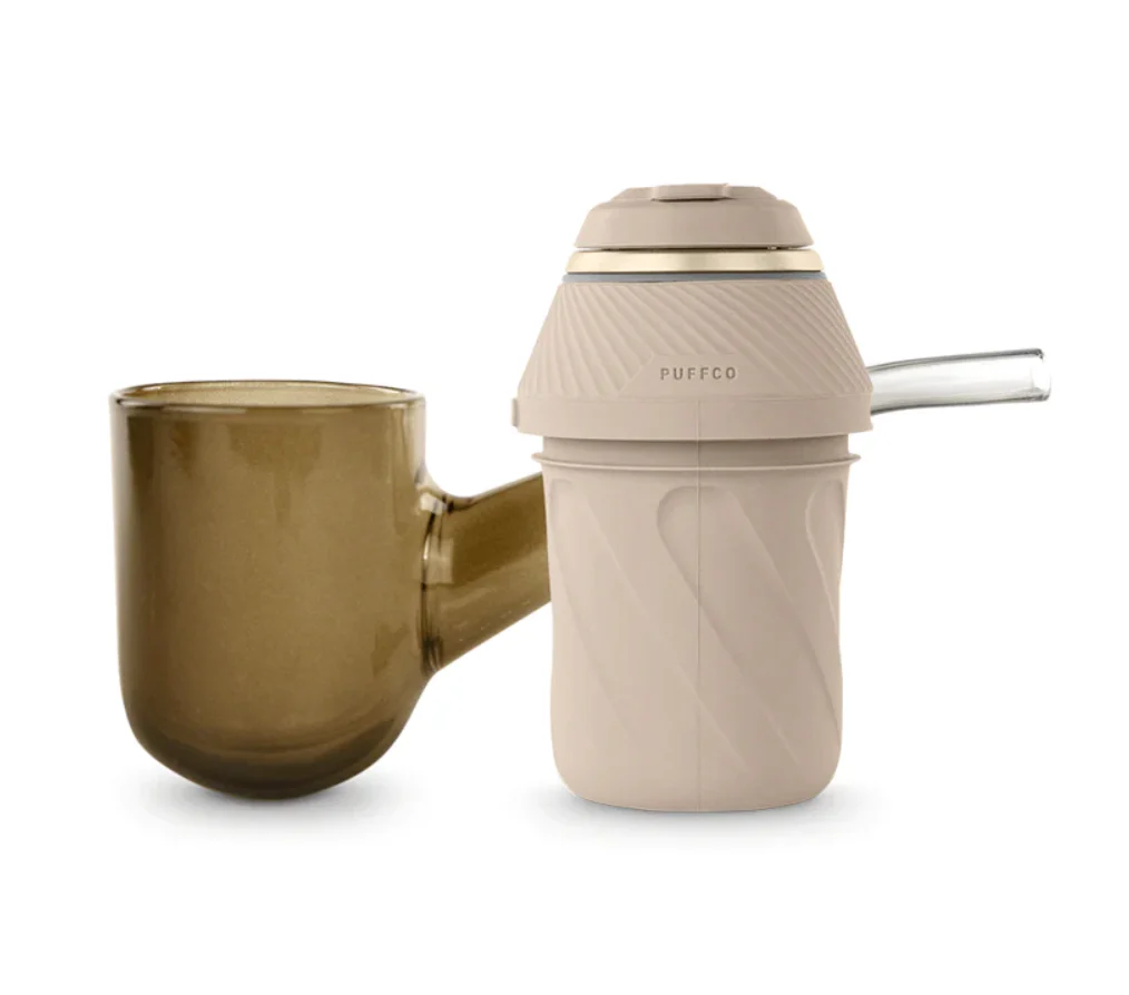 A brown glass mug and a beige electronic cigarette holder are shown against a white background.