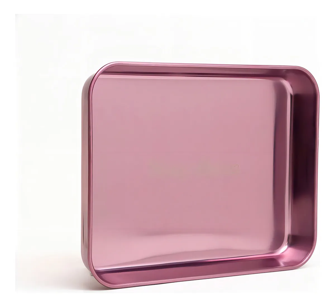 A rectangular, metallic, pink-colored baking tray with the text "Blazzy Susan" printed on it.