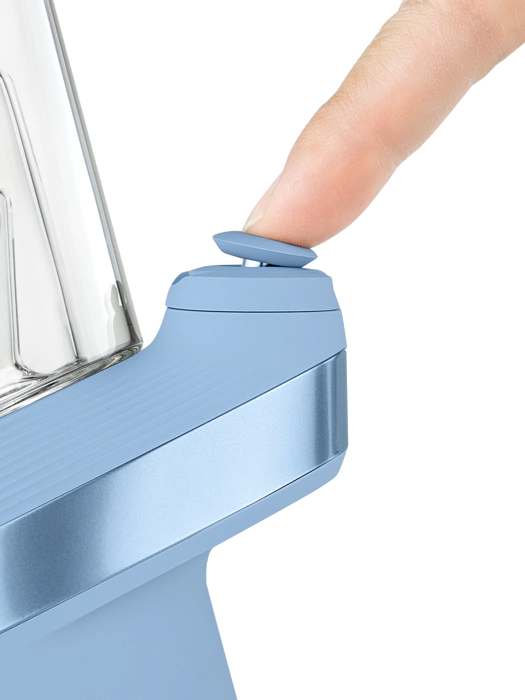 A person's thumb is pressing a button on a blue object, which appears to be a small electronic device.