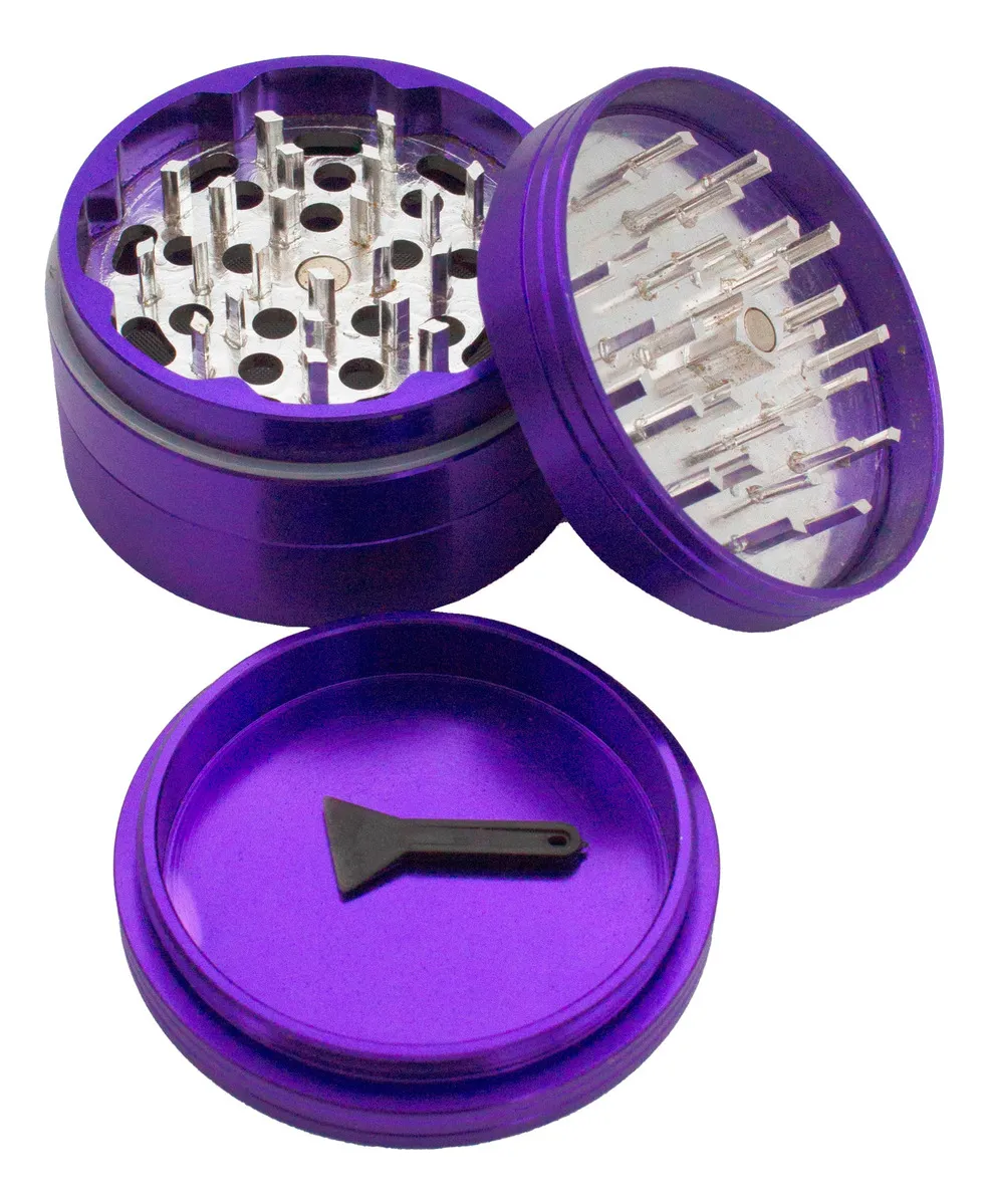 a purple grinder with a clear plastic lid and a black plastic tool inside.