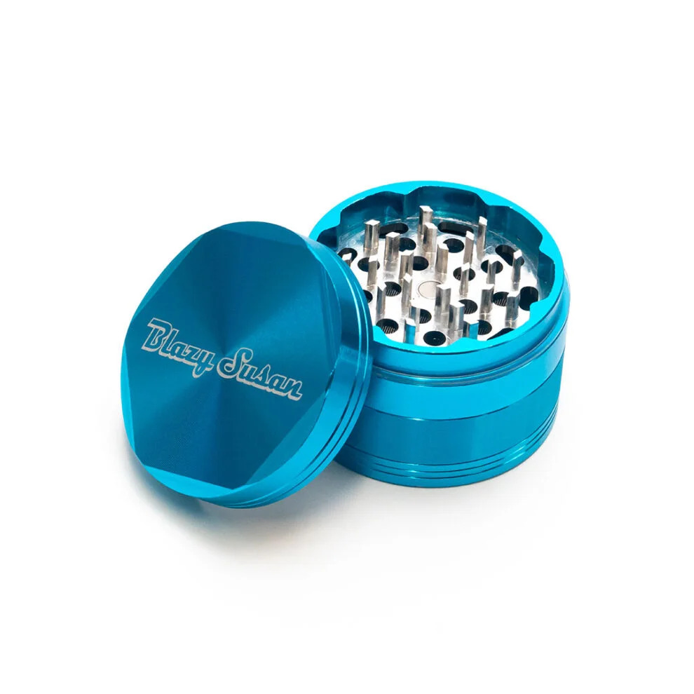 A blue grinder with a silver mesh inside, placed on a white background.