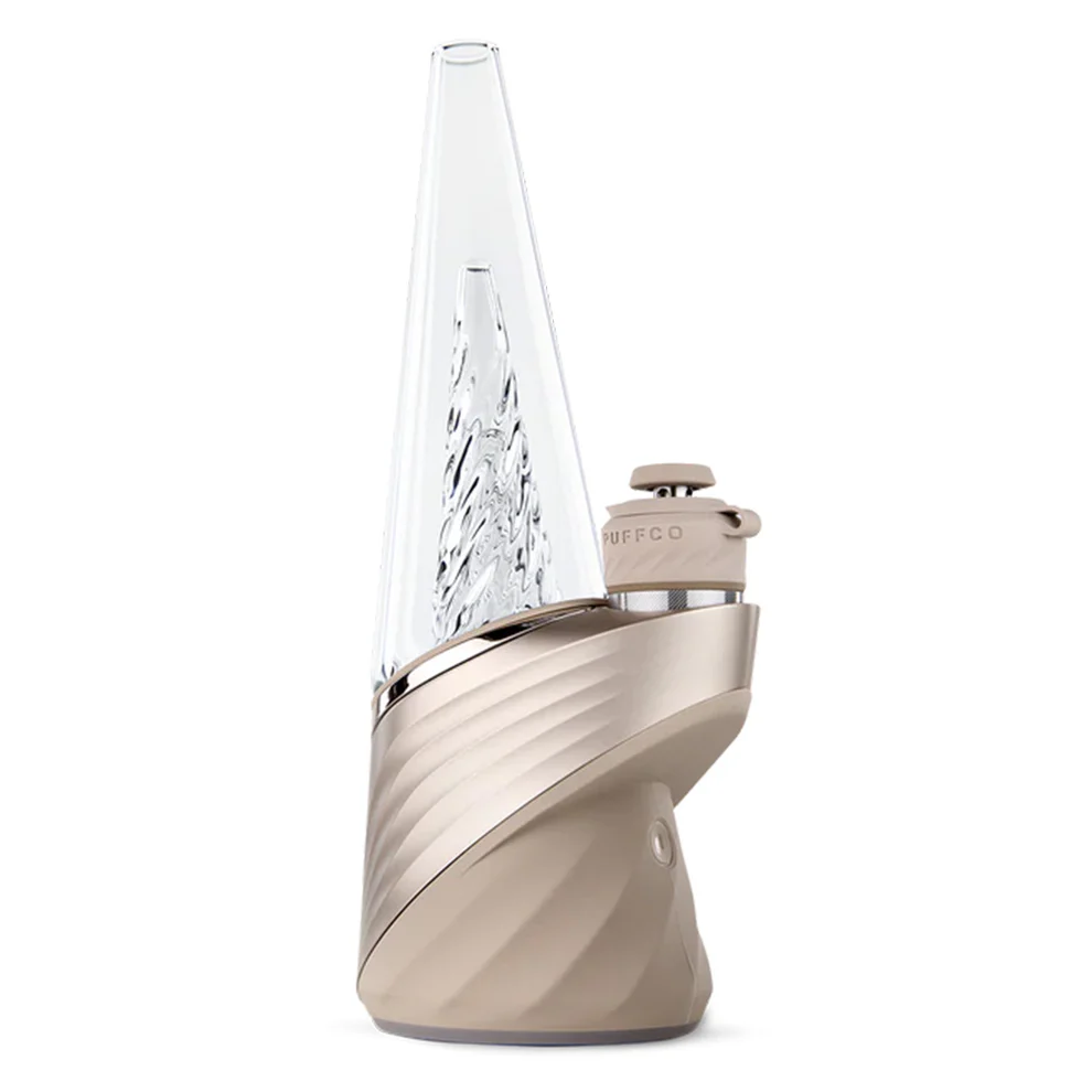 A beige electronic device with a clear glass tube and a small white cap on top, sitting on a white surface.