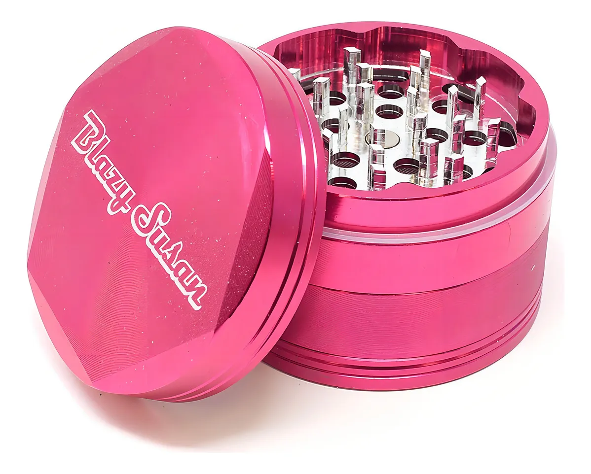 A pink metal grinder with a lid and a collection of small holes inside.