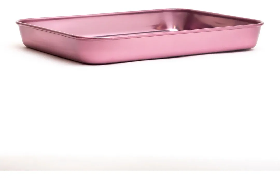 A pink rectangular cake pan is shown against a white background.