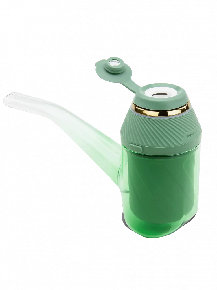 A green and white pipe-like object with a handle and a small circular object on top, possibly a pipe cleaner or a similar cleaning tool.