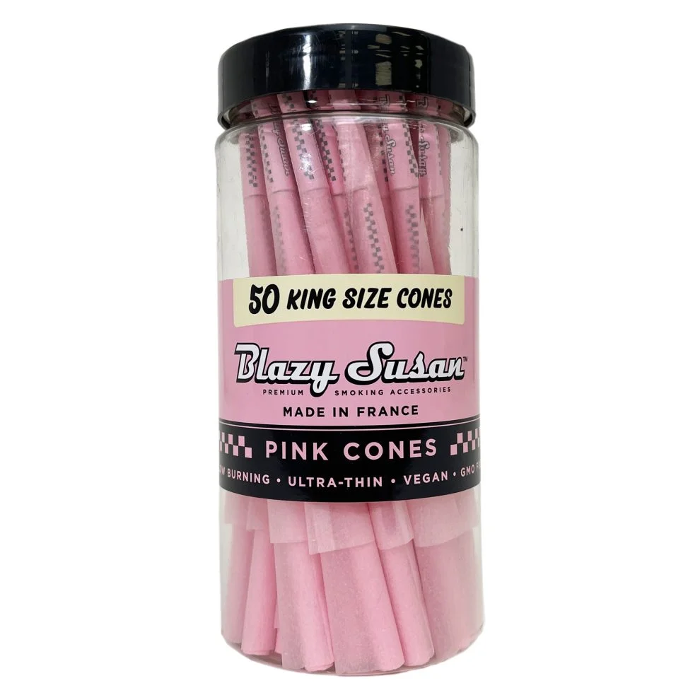 A clear glass jar filled with pink-colored rolling papers, labeled as 50 king size cones.