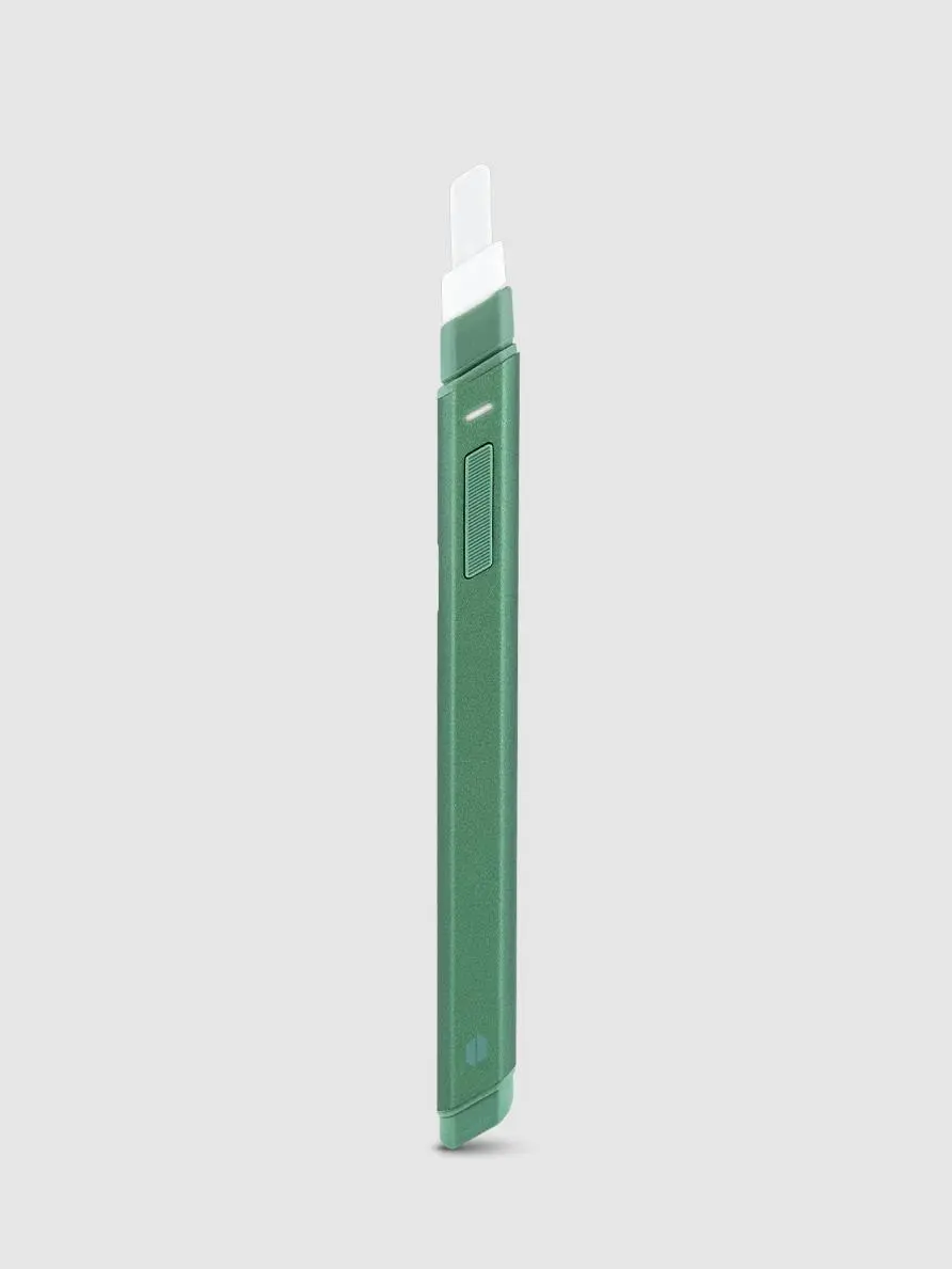 A green and white object, possibly a tool or utensil, is shown against a plain white background.