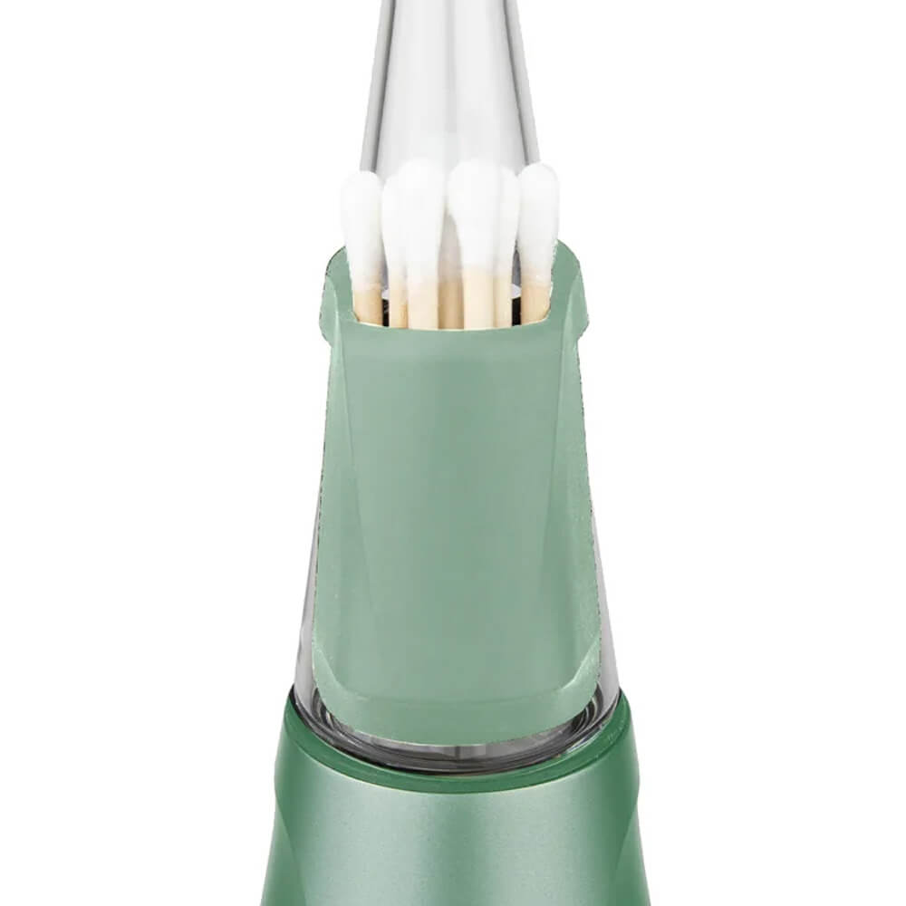 A green electronic device with a clear plastic container holding several white cotton swabs.
