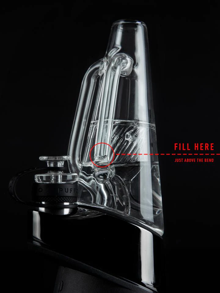 a clear glass pipe with a black handle, and there is a red circle indicating the point where the pipe should be inserted to fill it.
