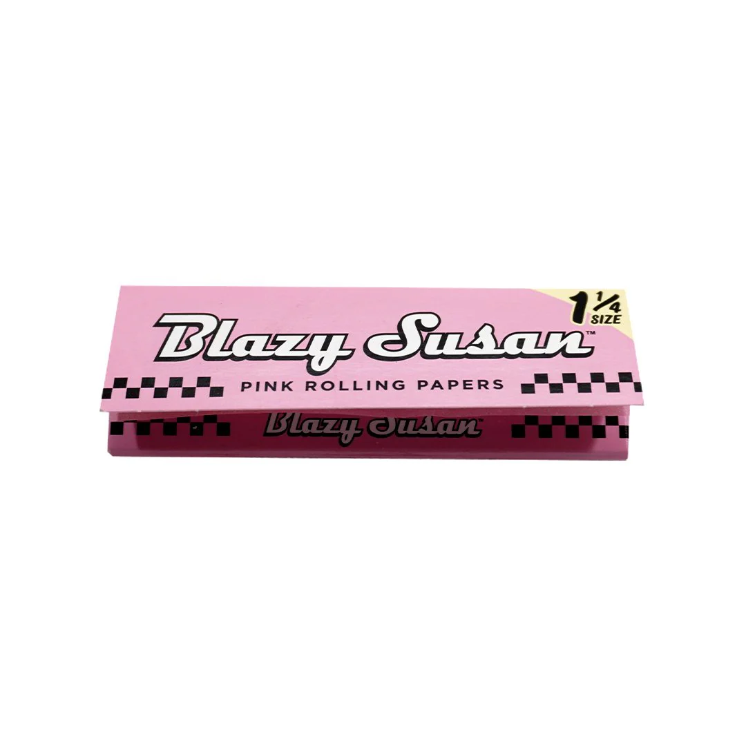 A pink and black box of pink rolling papers, labeled as "Blazy Susan" and "1/4 SIZE".