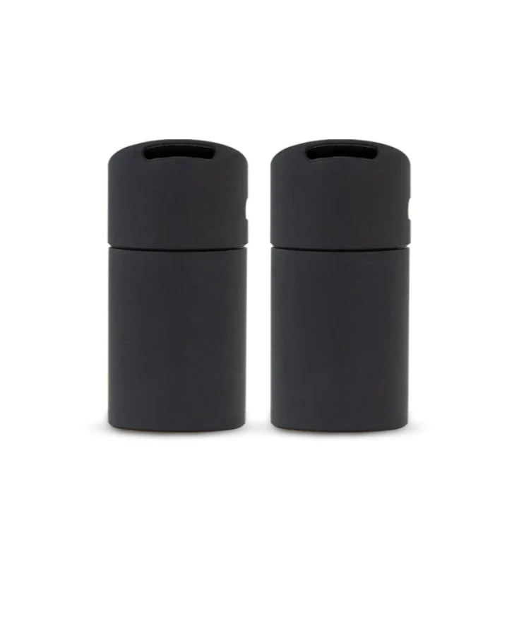 A white and black case containing two black electronic devices, likely headphones or earbuds, is shown against a black background.