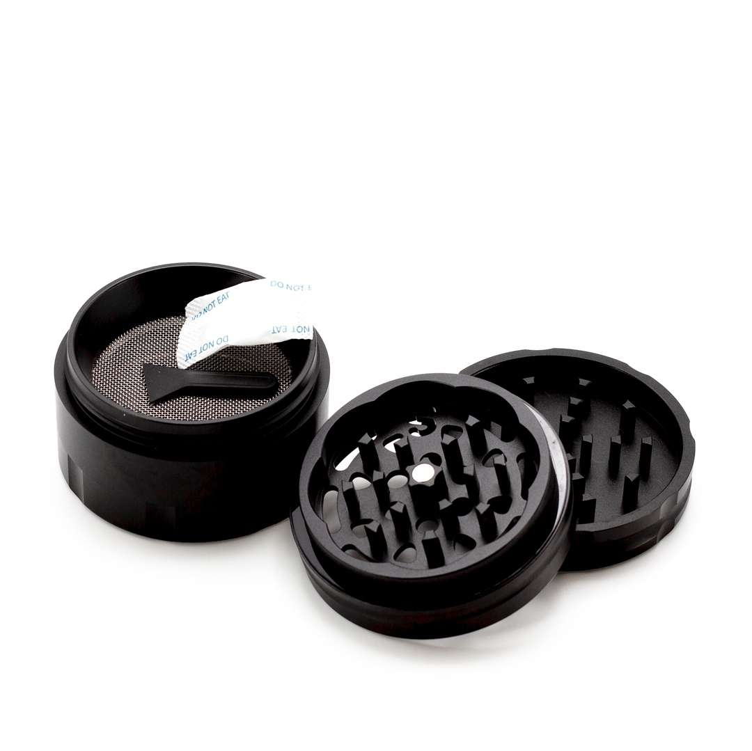 A black grinder with a mesh screen and a white label on it, placed on a white background.