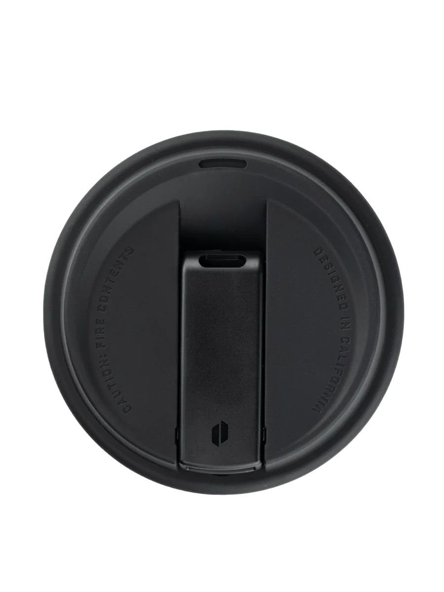 A black lid with a hexagonal design on it, which is a part of a larger black lid.