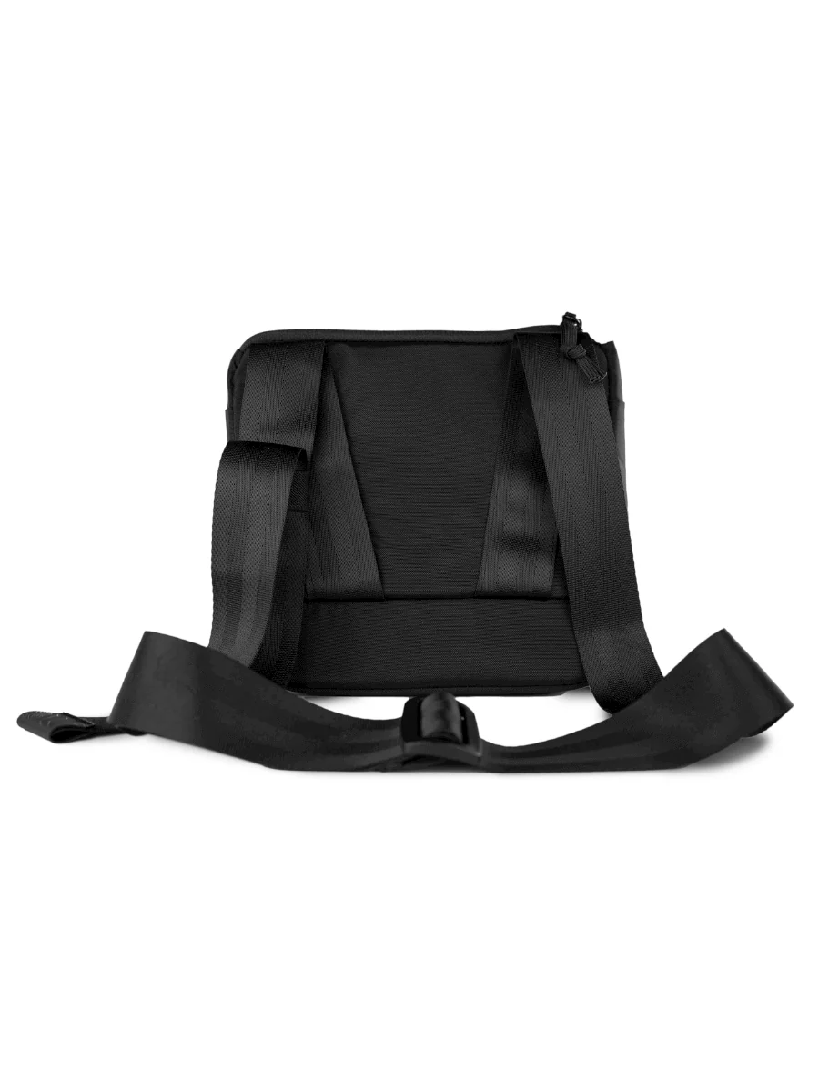 A black, rectangular bag with a zipper closure and a small logo on the front.