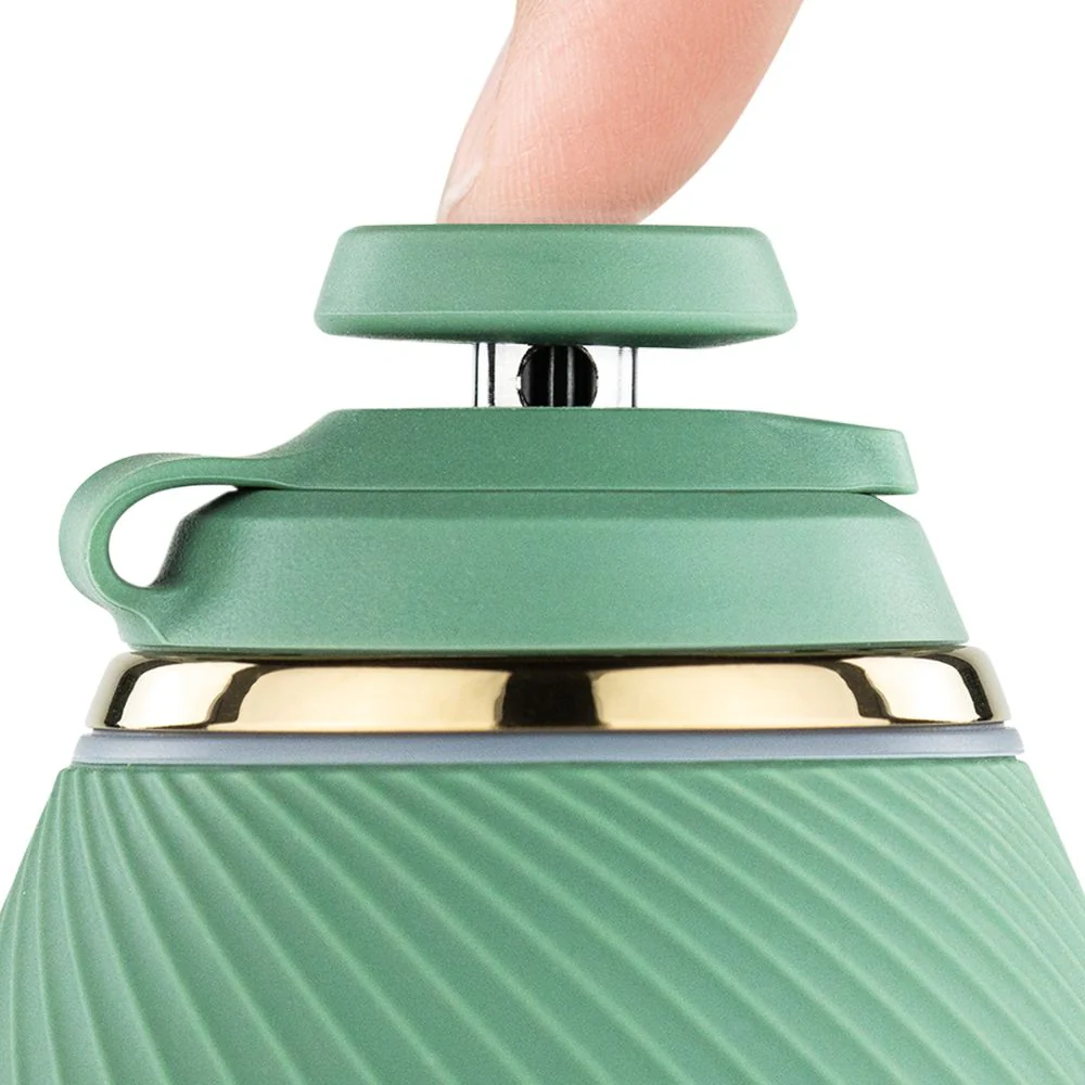 A green, curved object is shown against a black background.