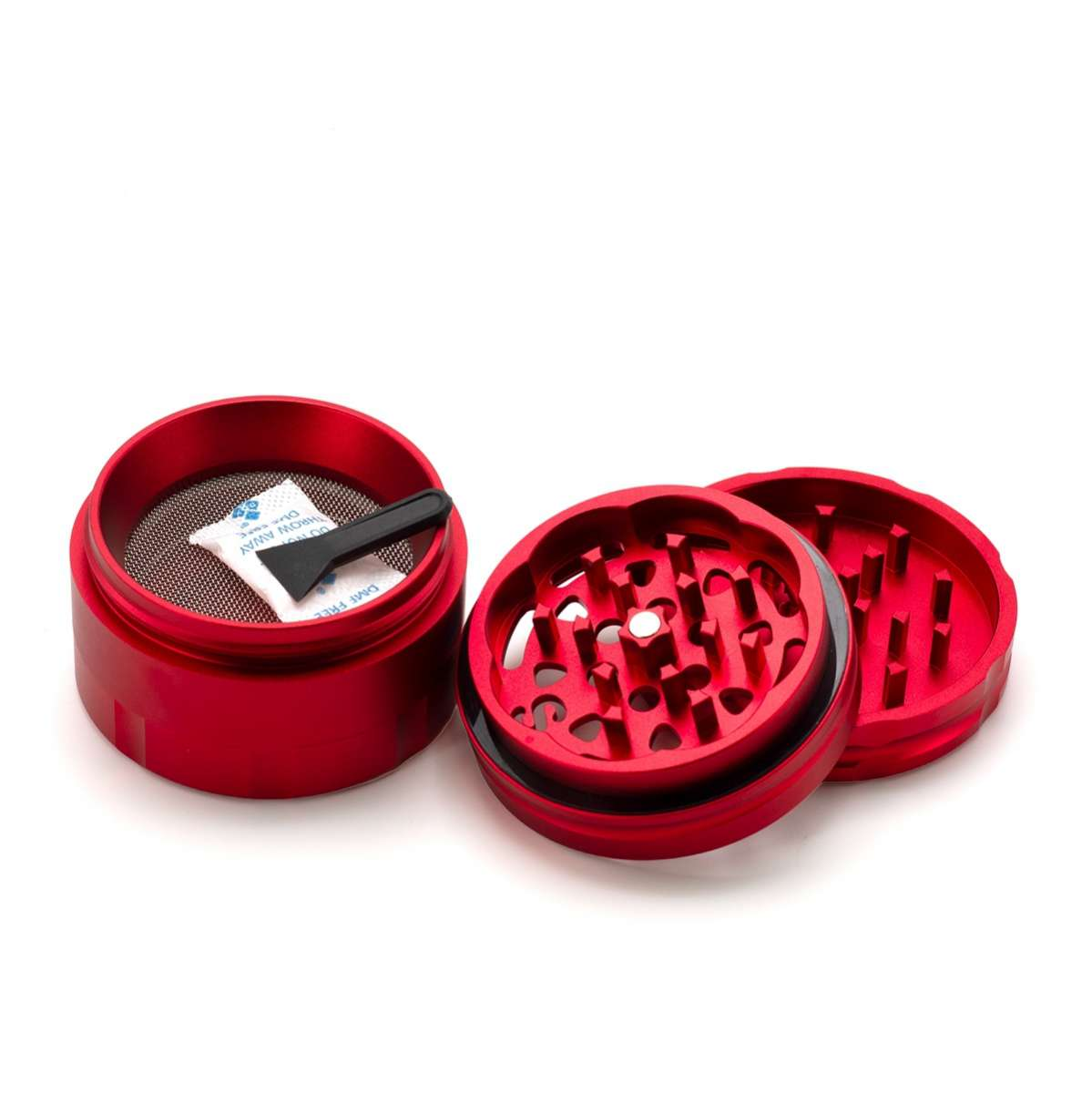 A red grinder with a black handle and a white packet inside, placed on a white background.