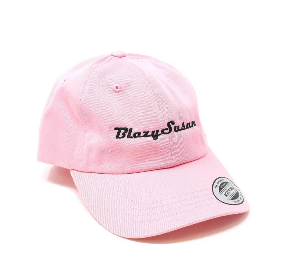A pink baseball cap with the text "Blazysus" printed on it.