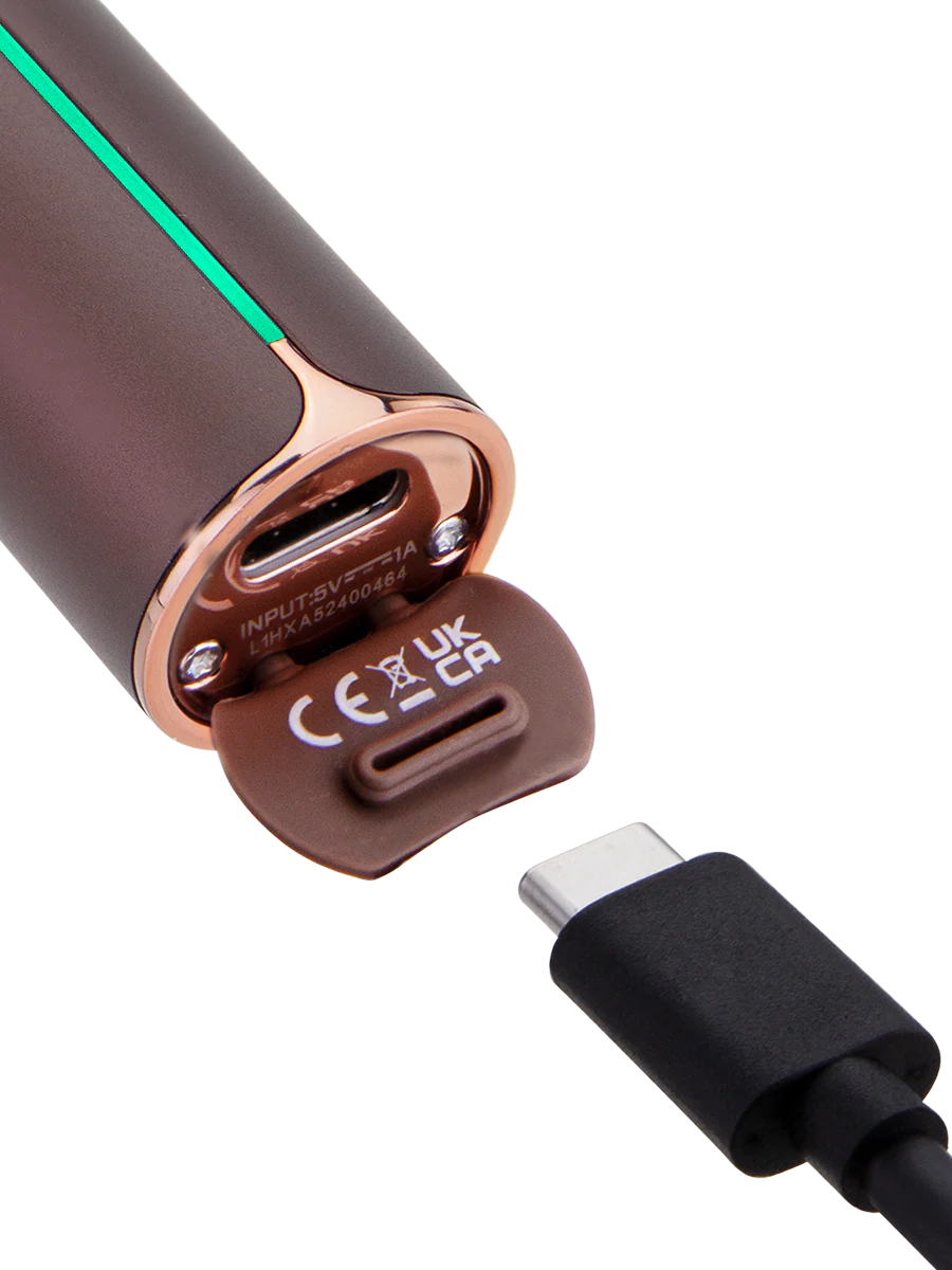 A brown electronic device with a USB connector attached to it, against a black background.