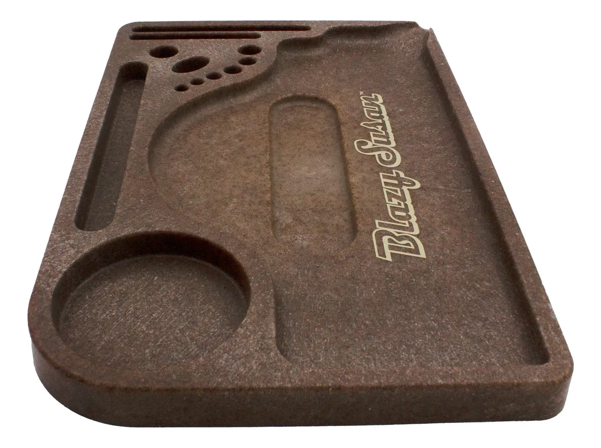 A brown, rectangular tray with various compartments and holes, likely used for organizing and storing items.