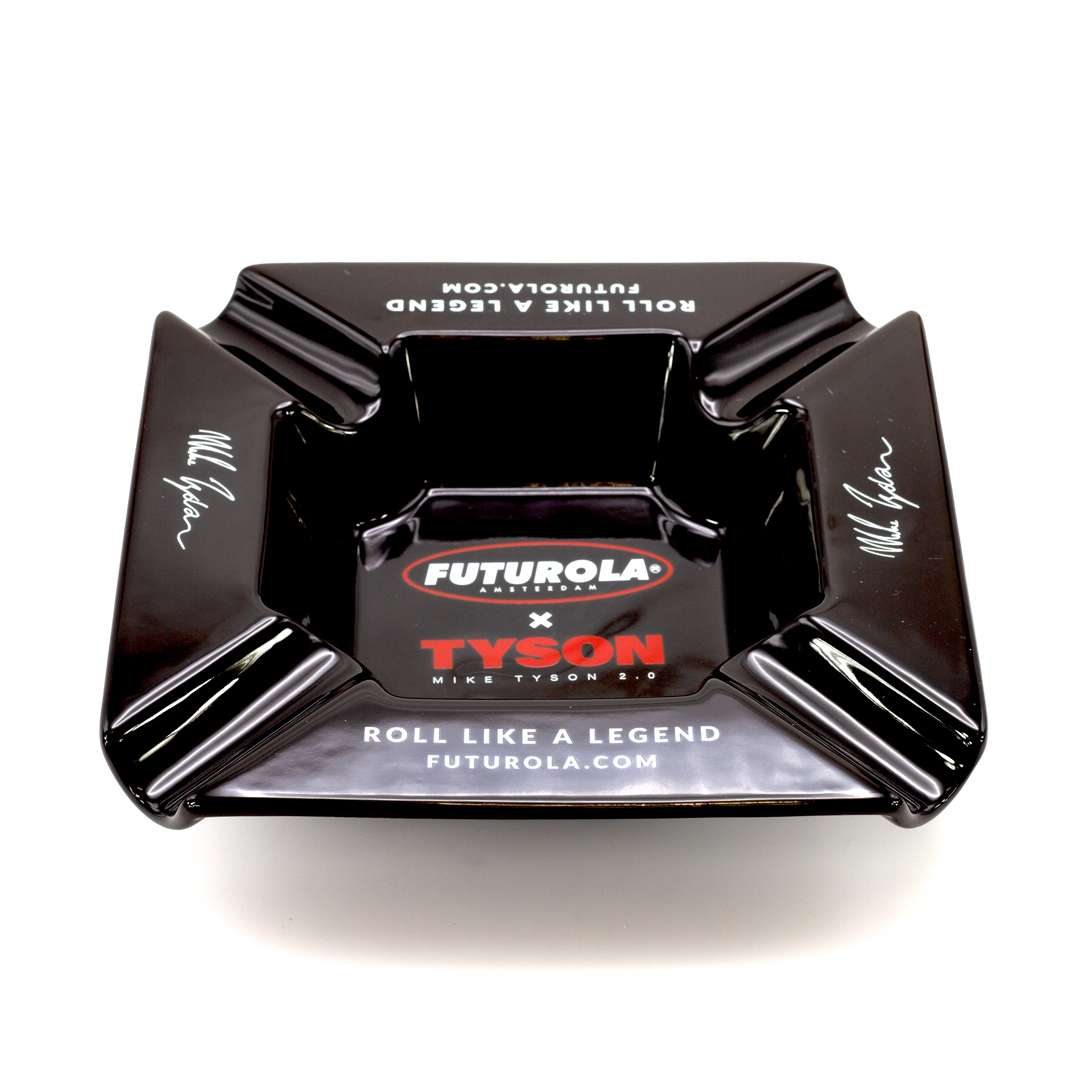 A black ashtray with the Futurola logo and the text "Roll Like A Legend" printed on it.