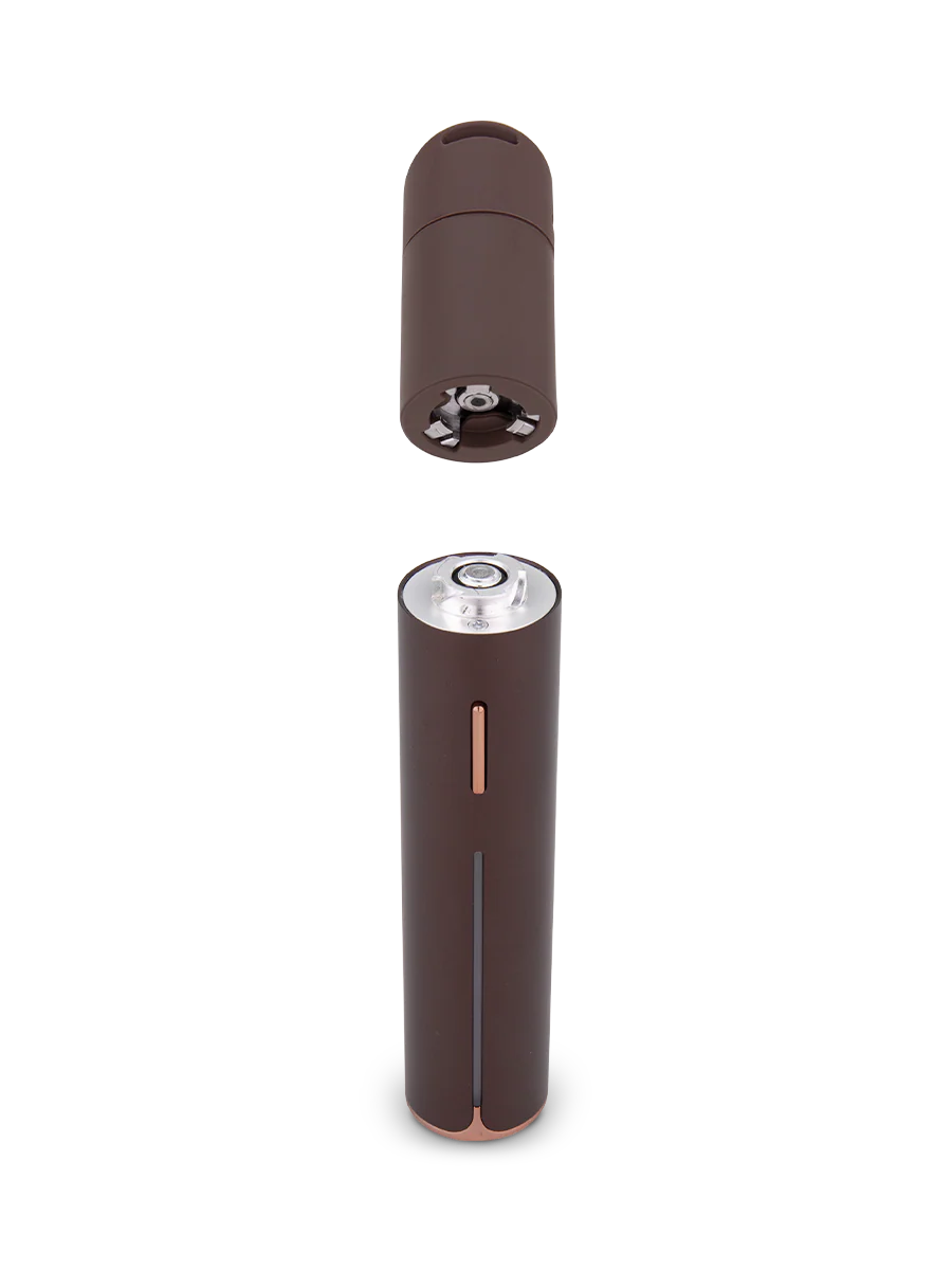 a brown cylindrical object with a silver top, which appears to be a battery or a similar cylindrical device.