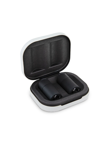 A white and black case containing two black electronic devices, likely headphones or earbuds, is shown against a black background.