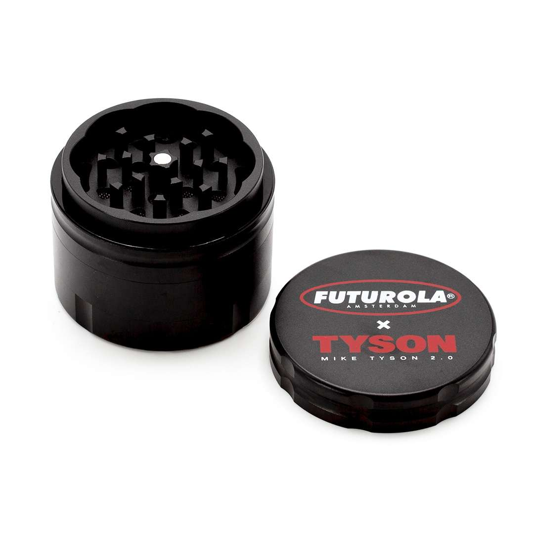 A black grinder with a lid featuring the Futurola Amsterdam logo and the name Tyson.