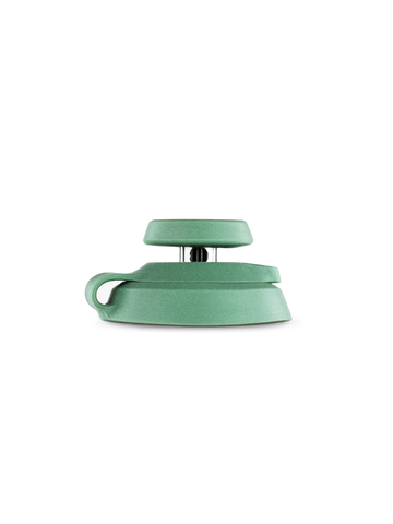 A green, curved object is shown against a black background.