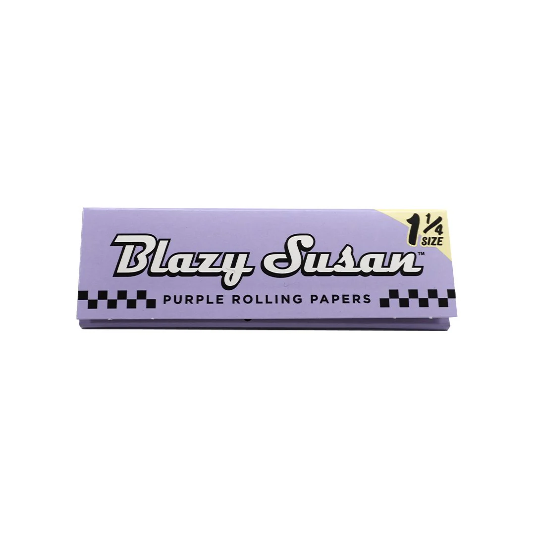 A pink and black box of pink rolling papers, labeled as "Blazy Susan" and "1/4 SIZE".
