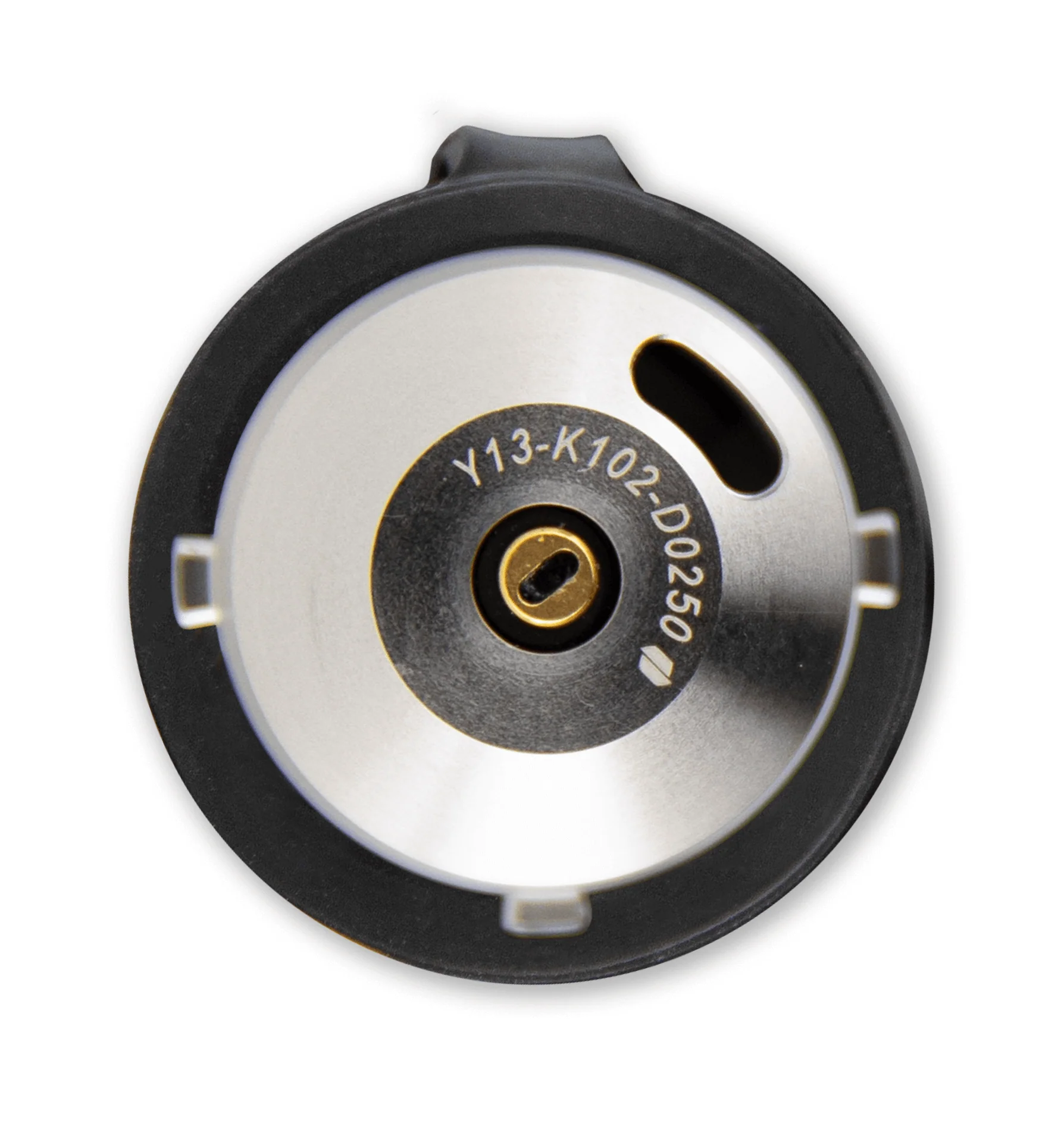 a close-up view of a metallic object with a circular shape, featuring a keyhole and a small hole.