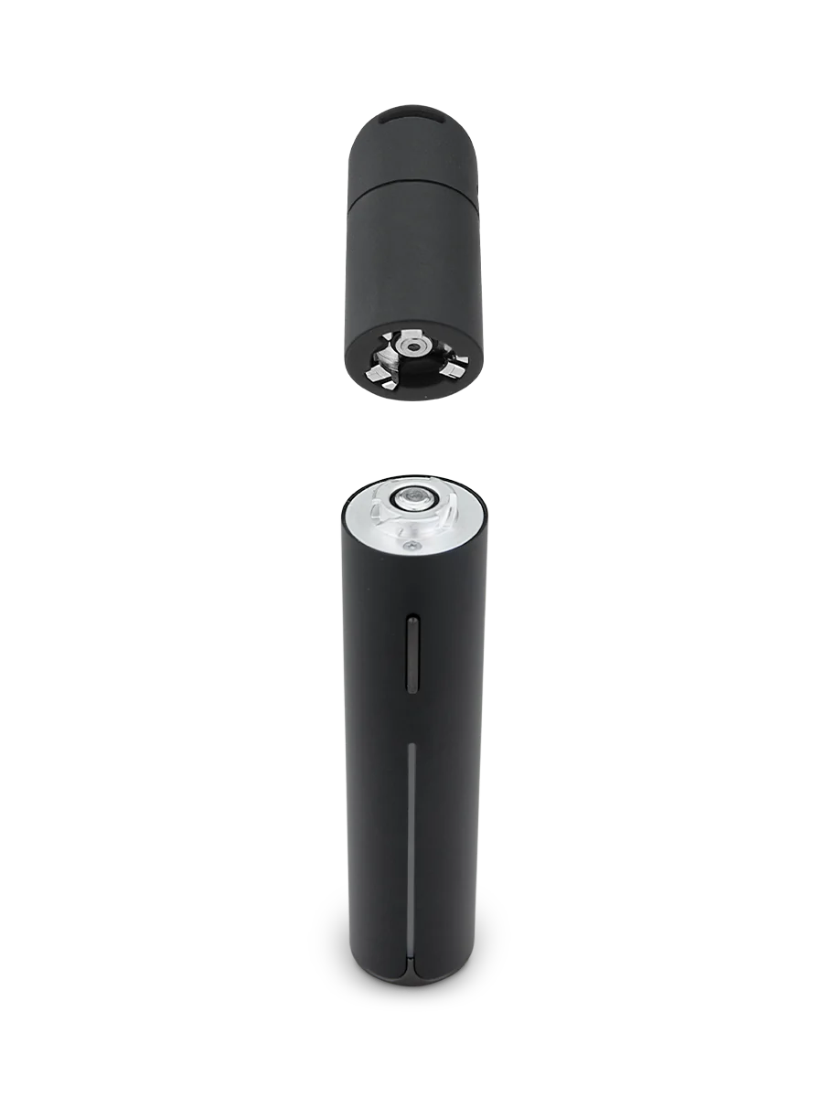 a black cylindrical object with a white circular top, set against a black background.